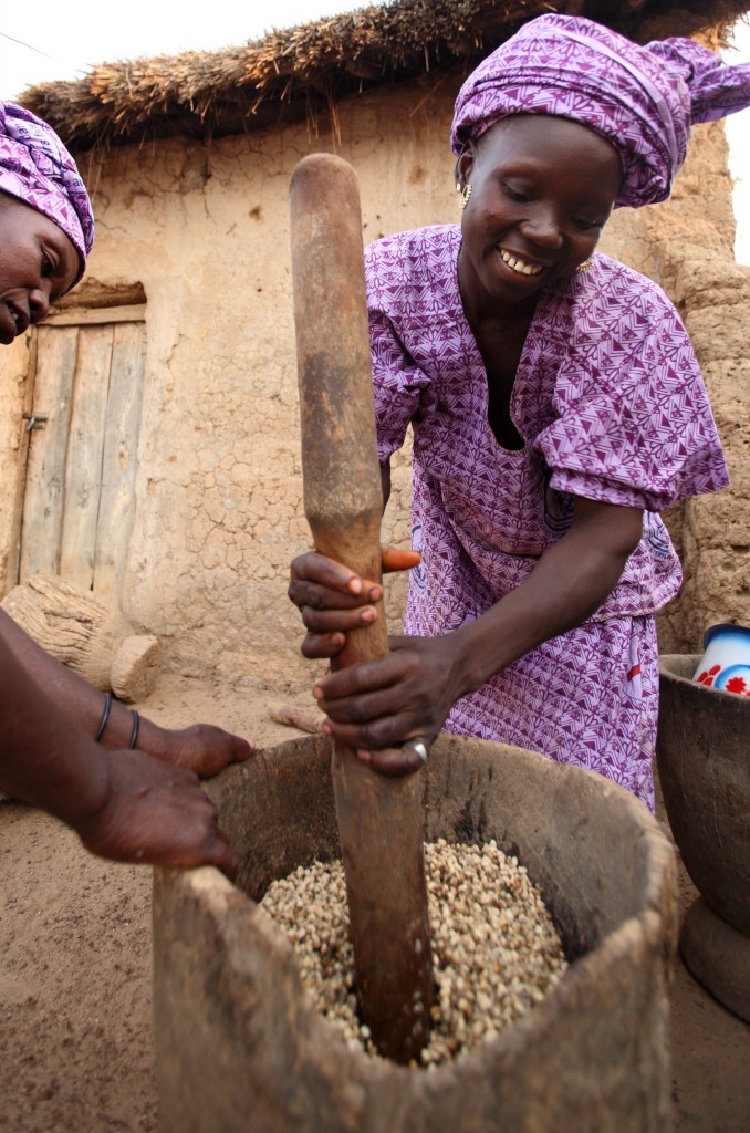 pounding beans to make flour