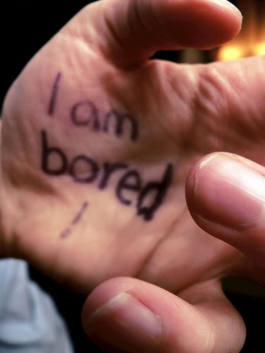 hand with "I am bored" written on it