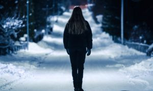 girl looking out at snow