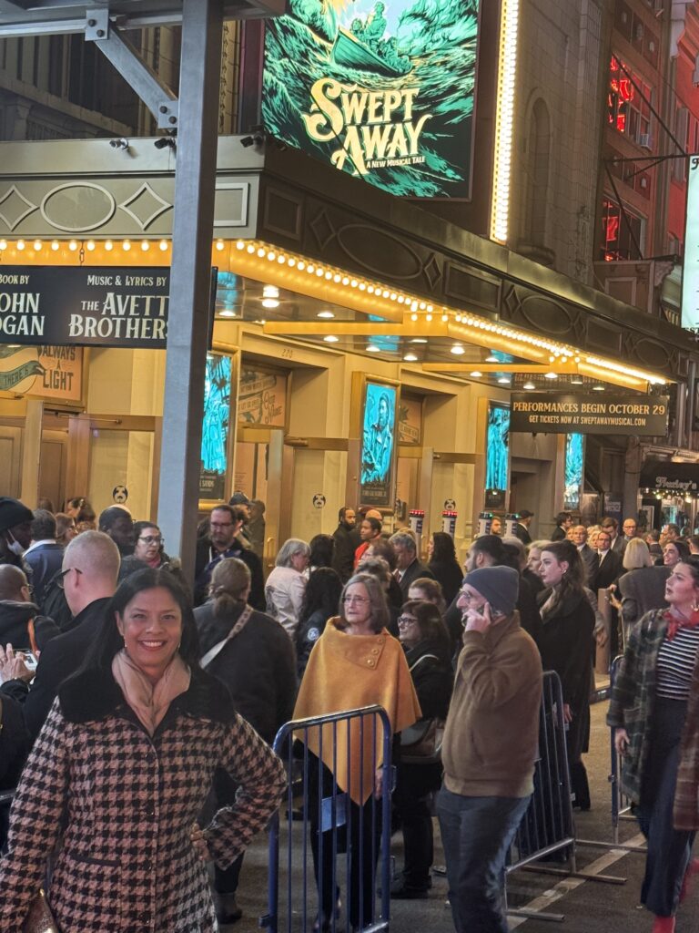 Shonali Burke standing in front of the Longacre at the Broadway opening of Swept Away